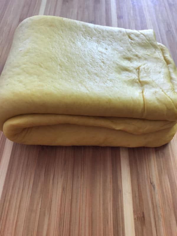 A close up of a folded dough