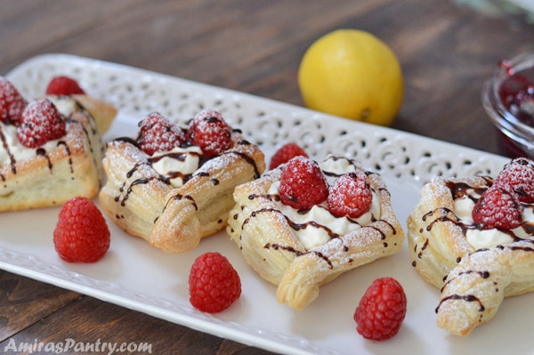 A plate of lemon raspberry tarts