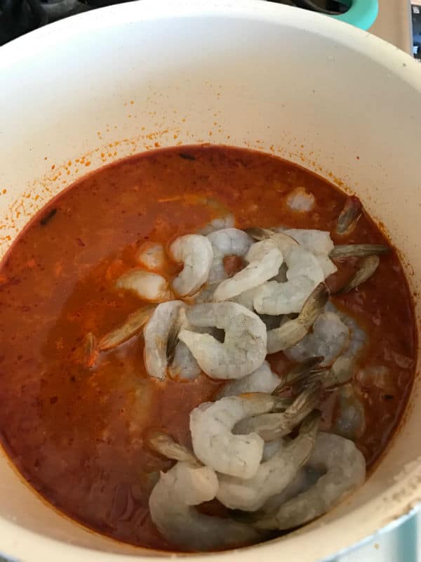 Shrimps being added to the pot