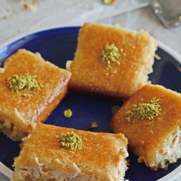 A plate of food, with Basbousa cake pieces