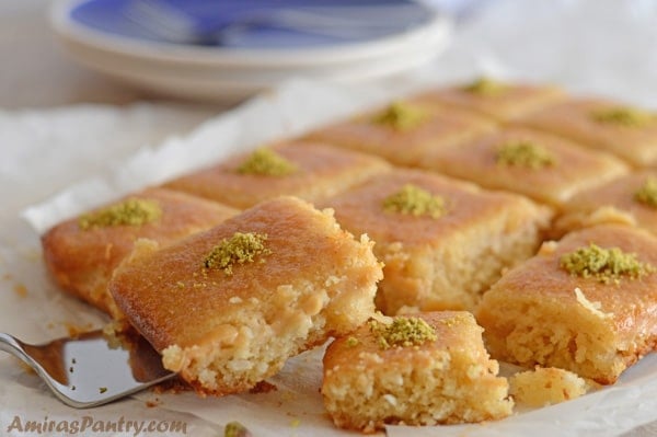 A plate of food, with Basbousa cake pieces