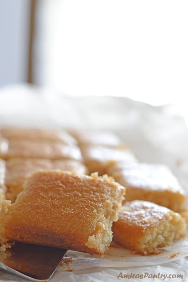 A plate of food, with Basbousa cake pieces