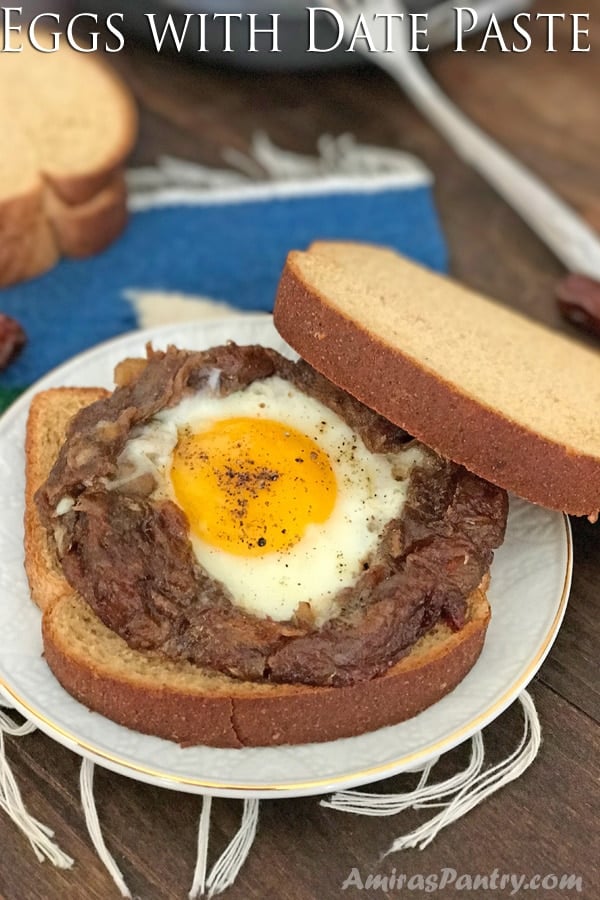 A piece of bread on a plate, with Egg and date paste