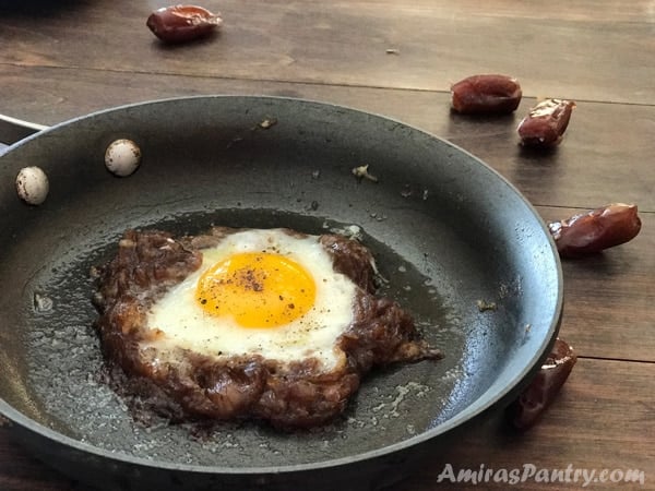 A pan of food, with Egg and date paste