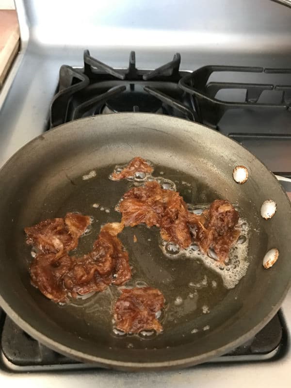 A pan of food on a stove top oven with date paste