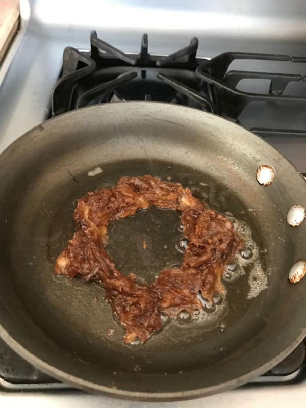 A pan of food on a stove top oven with date paste