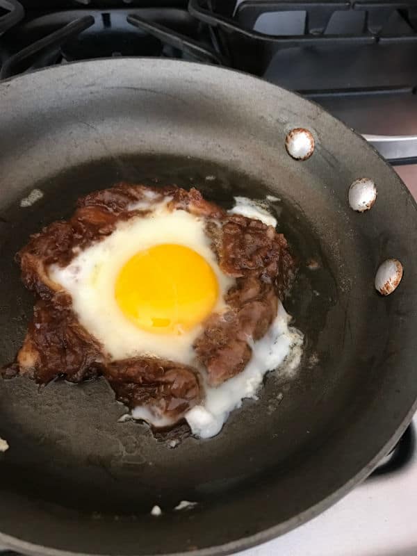 A pan of food on a stove top oven with date paste and egg