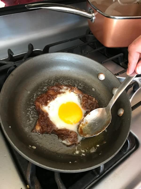 A pan of food on a stove top oven with date paste and egg