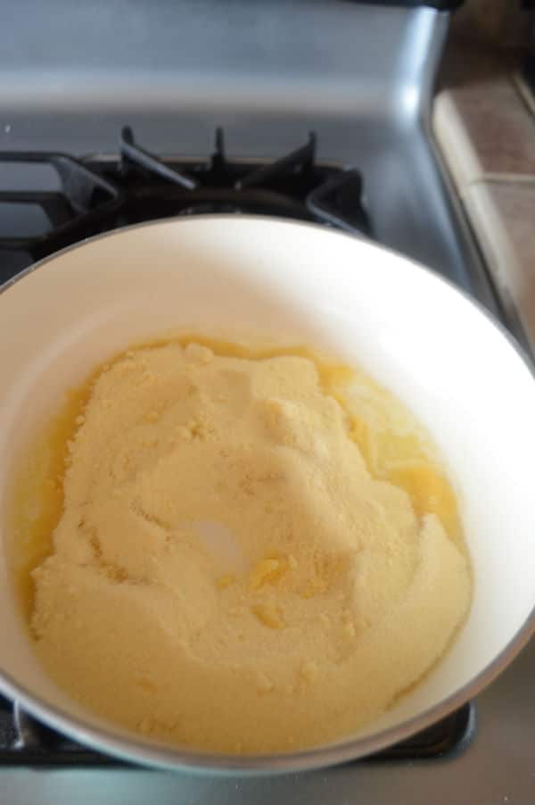 A pan of food on stove with Semolina and butter