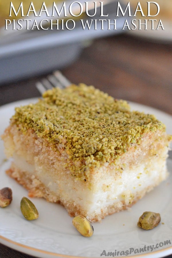 A close up of a slice of cake on a plate, with Pistachio
