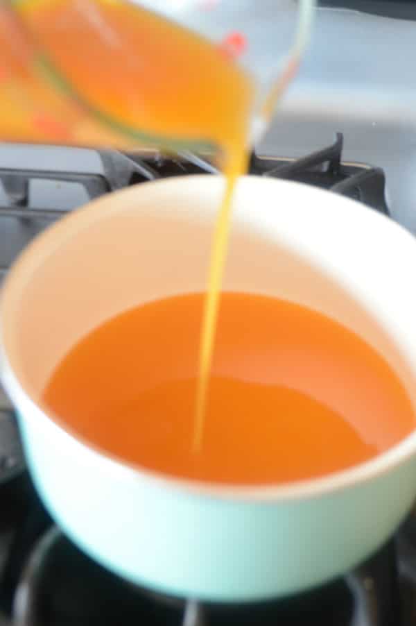 A close up of a bowl of apricot juice