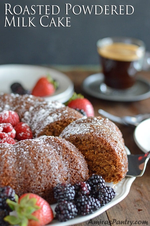 A plate of food on a table, with powdered Cake