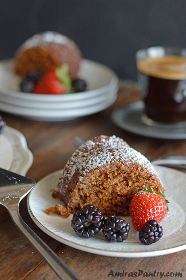 A plate of food with a slice of cake on a table, with Powdered milk