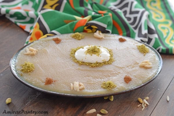 A plate with food on a table, with semolina pudding