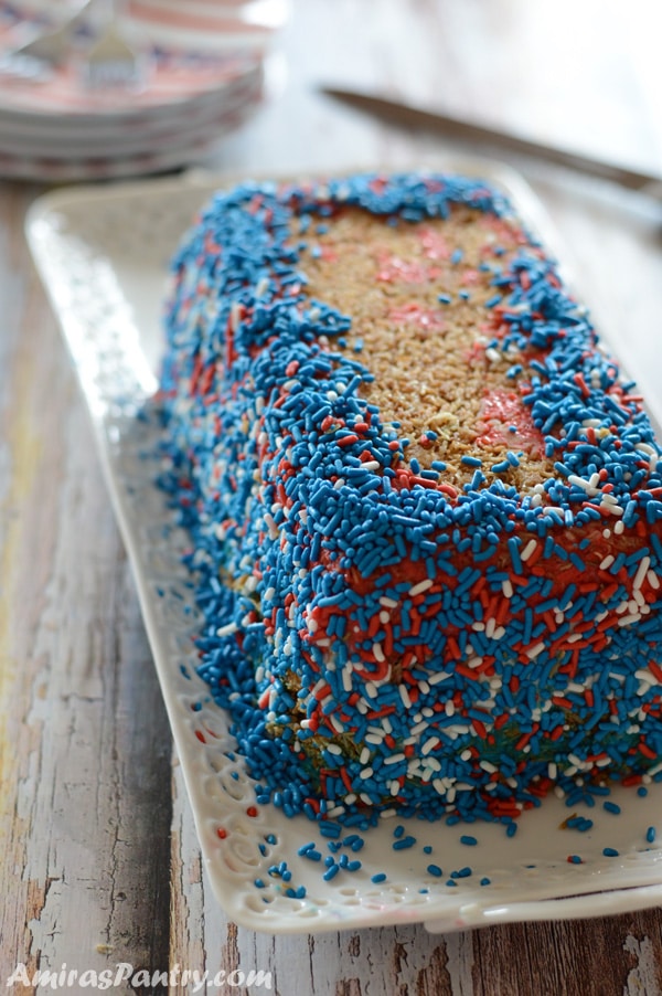 A cake on a plate with Red, White and blue colors