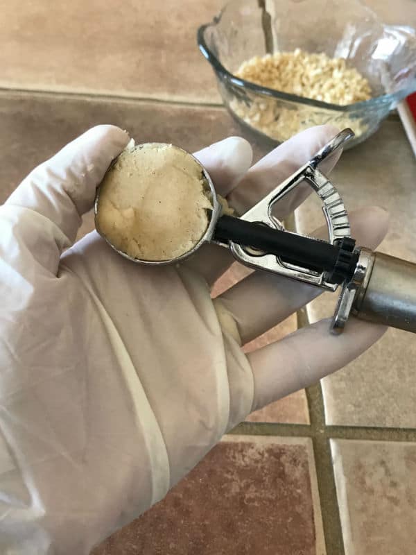 A hand making a ball dough