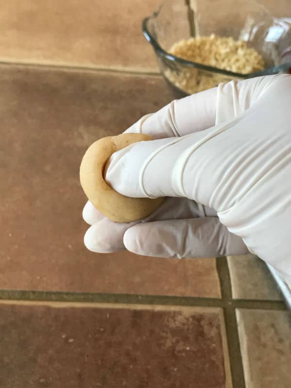 A hand making a ball dough