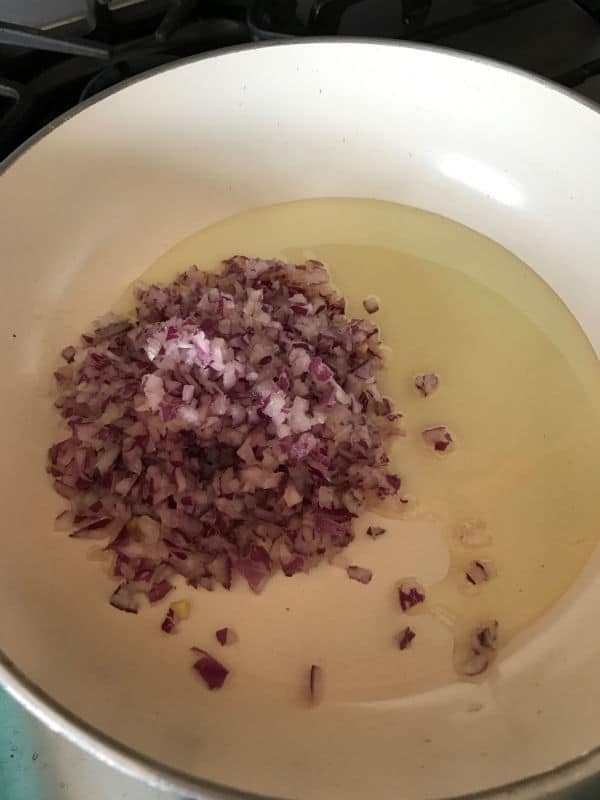 A bowl of oil and onions 
