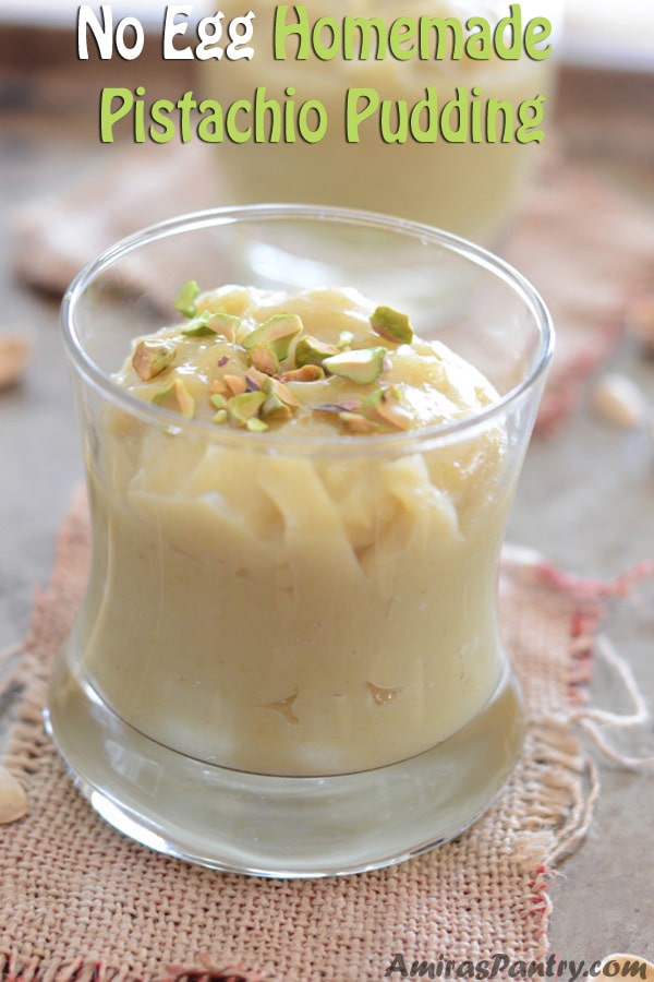 A cup of food on a table, with Pistachio and Pudding