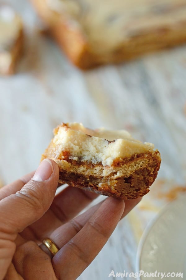 A half eaten piece of food, with Milk marble dessert