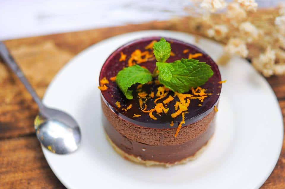 A close up of a piece of cake on a plate, with Mint and Mousse