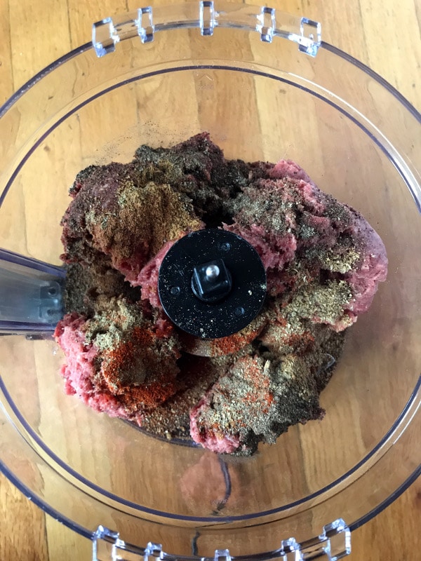 A photo showing a step mixing corned beef in a blender