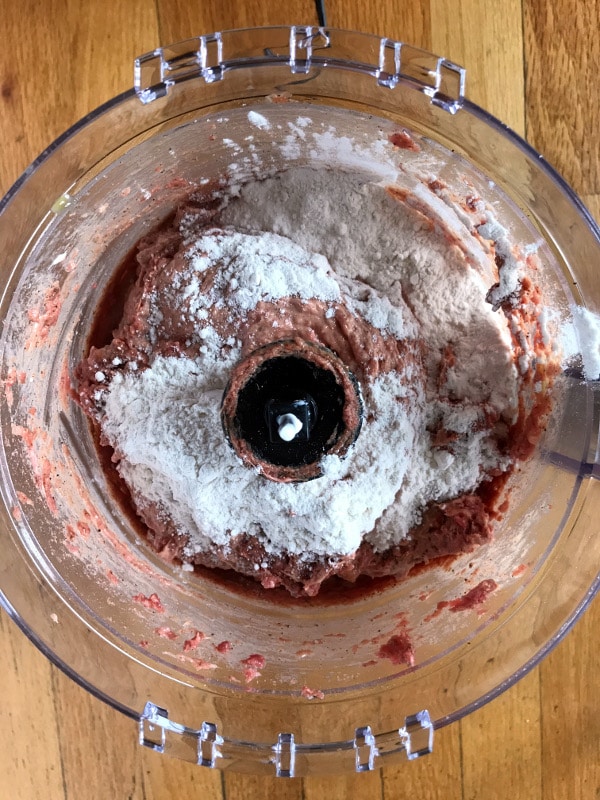 A photo showing a step mixing corned beef in a blender