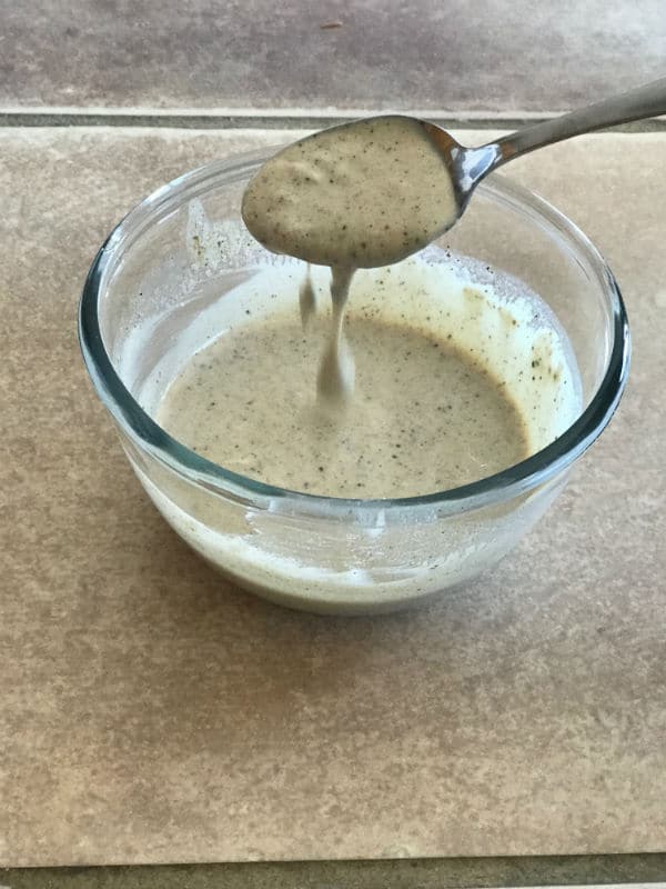 A bowl of Tahini mixture for Eggplant Salad