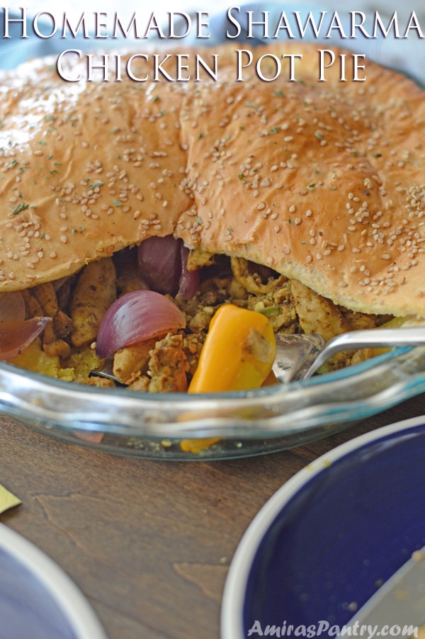 A sandwich with chicken filling on a plate, on top of a table