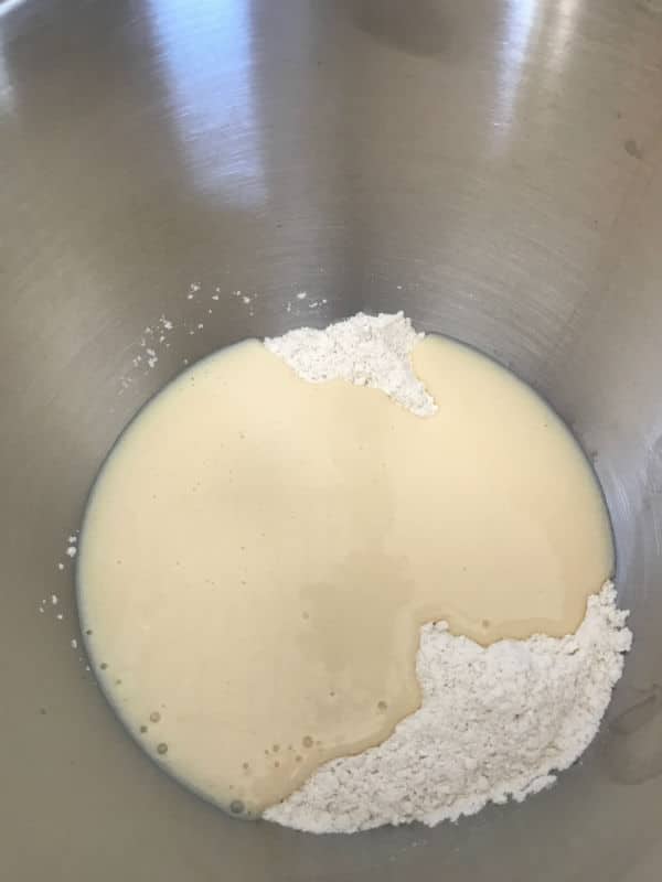 A photo showing Bread mix in a metal bowl