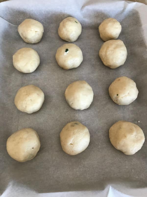 Step by step photos for making Stuffed pizza balls, dough on a sheet pan