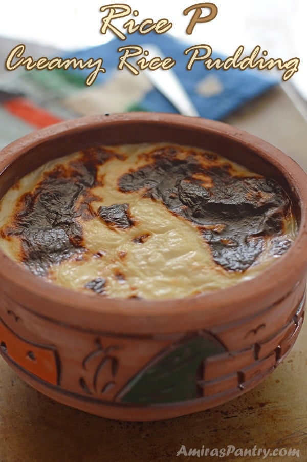 A bowl of food on a table, with Rice pudding