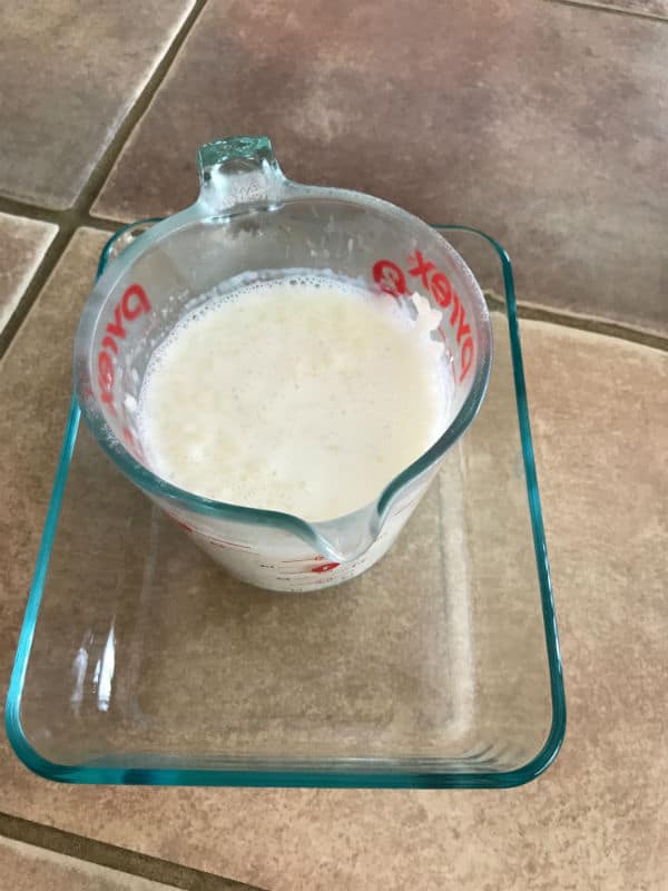 A glass jar with rice and milk