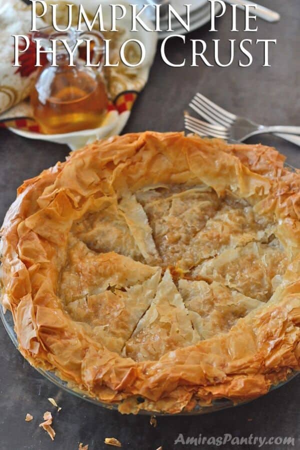 A plate of food on a table, with pumpkin Pie