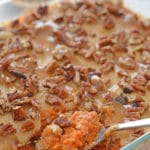 A close up of a pan with pumpkin and nuts