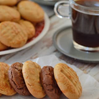 A plate of food and a cup of coffee, with Cookies