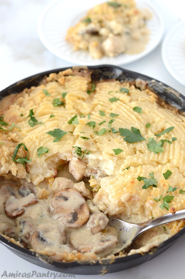 A pan of food, with Potato, mushroom and Cream