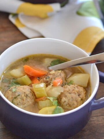 A bowl of food, with Turkey balls and Soup