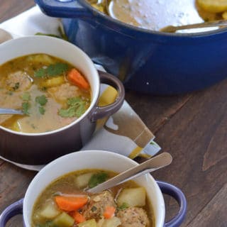 A bowl of Turkey Albondigas soup on a table