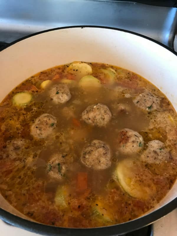 A close up of a bowl of Turkey Albondigas soup