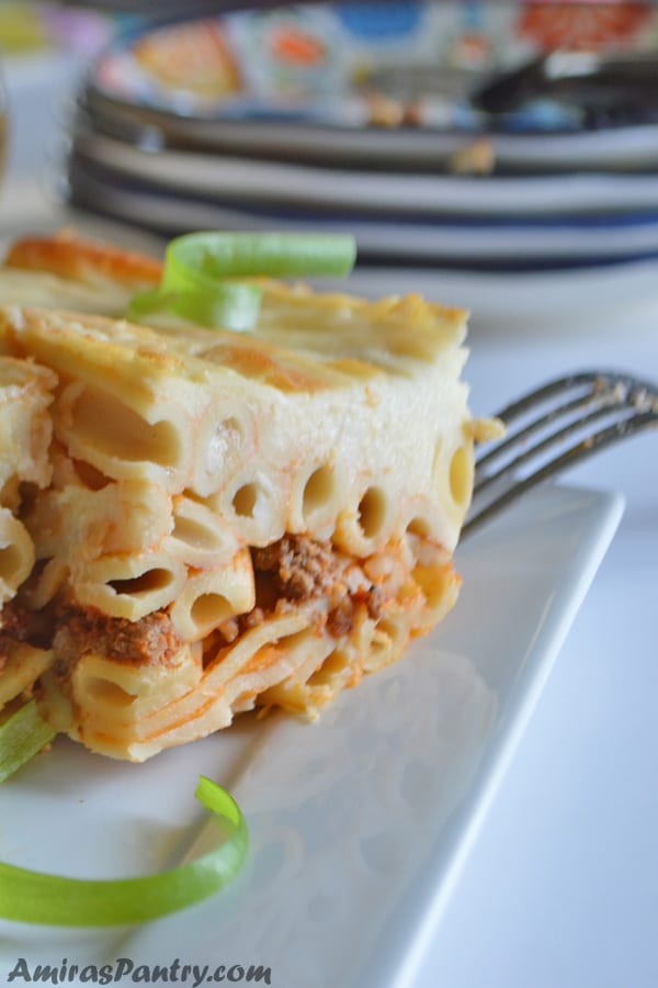 A close up of a piece of Baked Pasta with ground beef in a dish