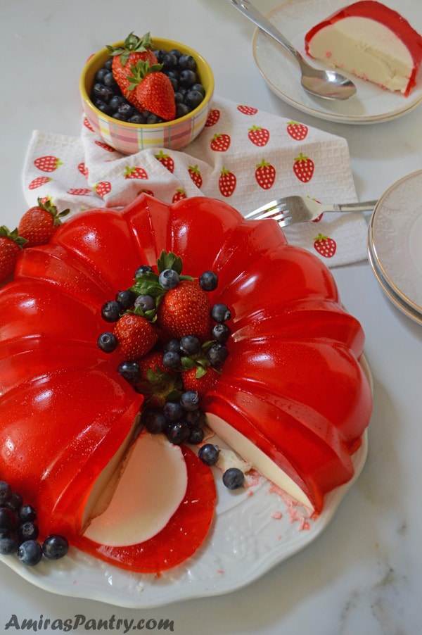 A plate of food on a table, with Jello and cream cheese