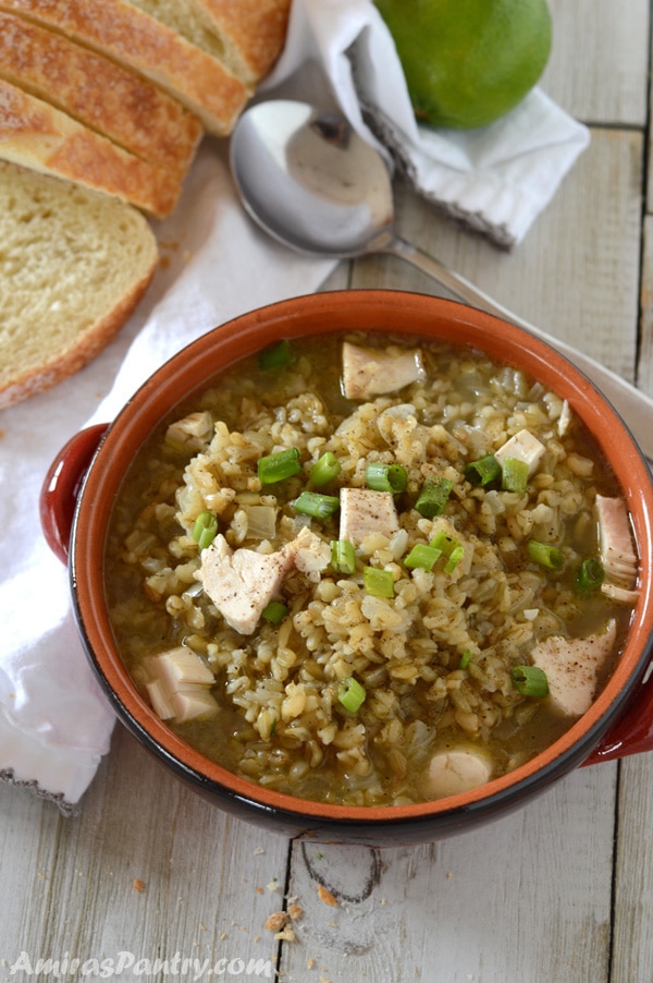 A bowl of food on a table, with Freekeh Soup