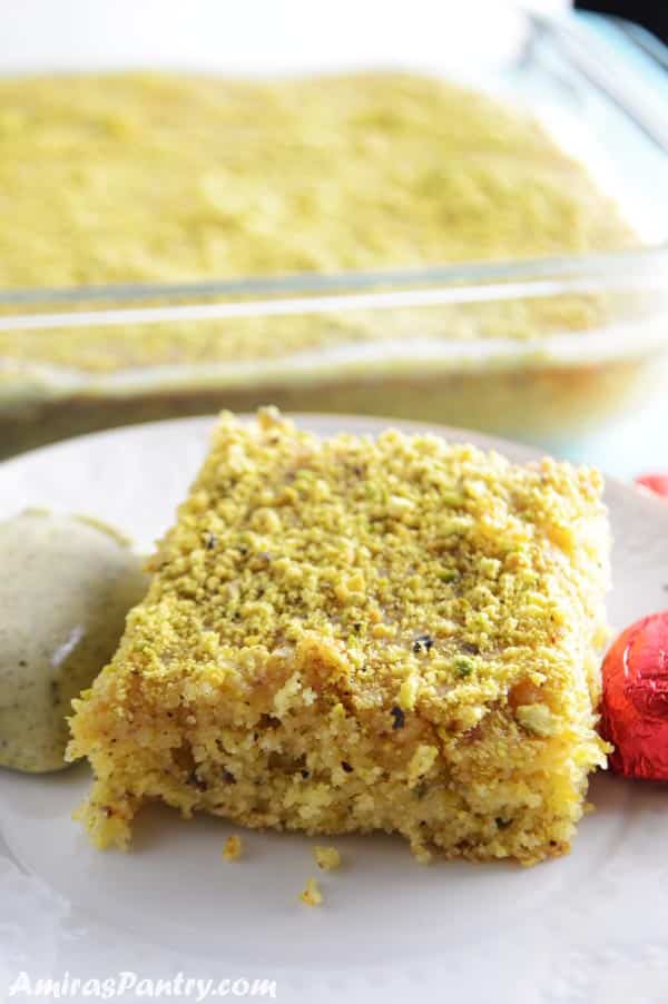 A piece of cake on a plate, with Pistachio and Semolina