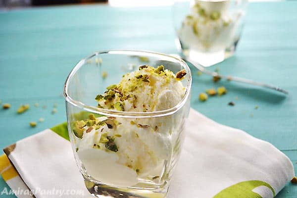A cup with scoops of Lebanese booza ice cream topped with pistachios