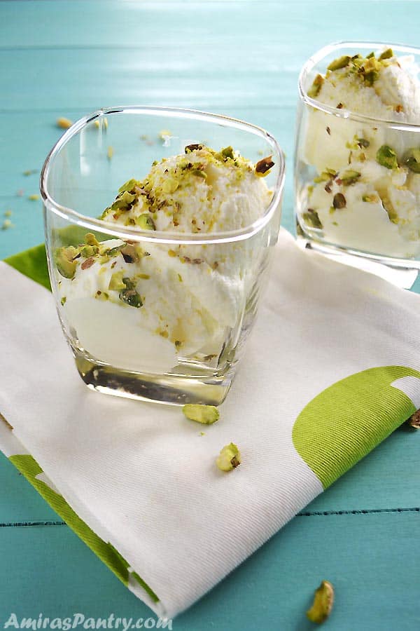 Two cups of Lebanese Booza ice cream spronkled with pistachios.