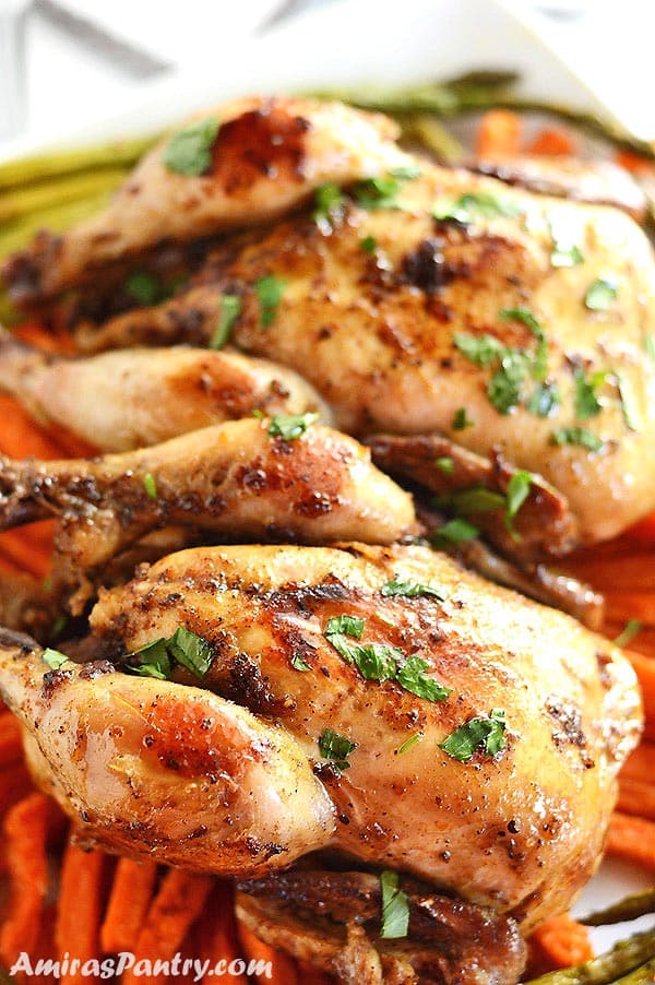 A close up of Cornish chicken hen on a plate