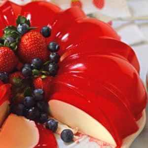 A close up photo of cream jello Cake on a plate