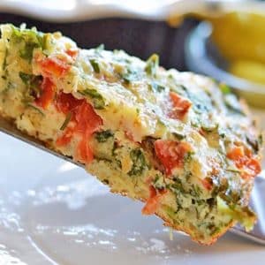 A close up of a slice of frittata