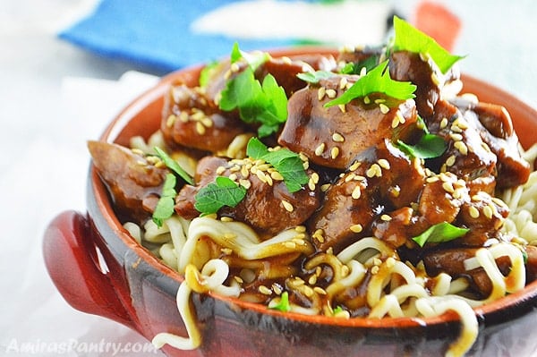 A close up of a plate of food, with Tamarind Chicken and pasta